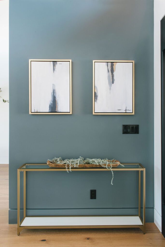 Teal accent wall showing how wall color and baseboard color are the same